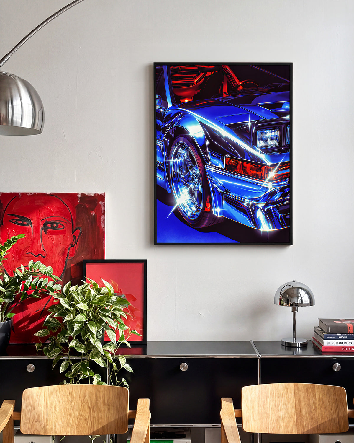 Chrome Ferrari supercar art print in a black frame on a room wall