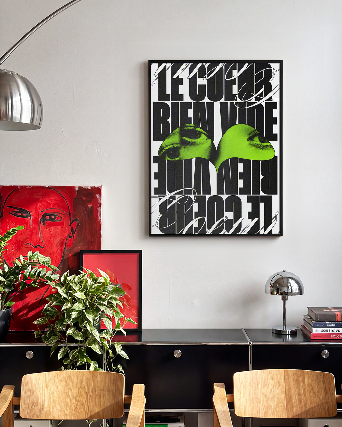 Le Cour Bien Vide French typography poster in a black frame on a room wall