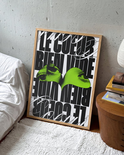 Le Cour Bien Vide French typography poster in an oak frame on a room wall
