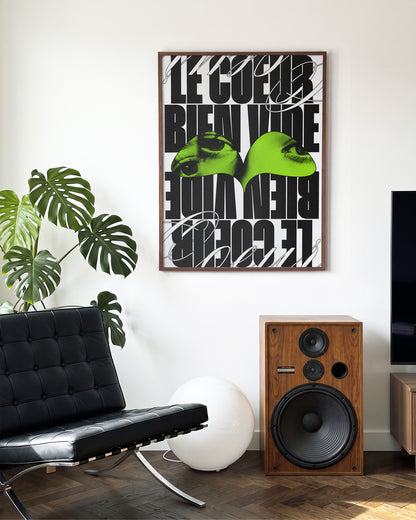 Le Cour Bien Vide French typography poster in a walnut frame on a room wall