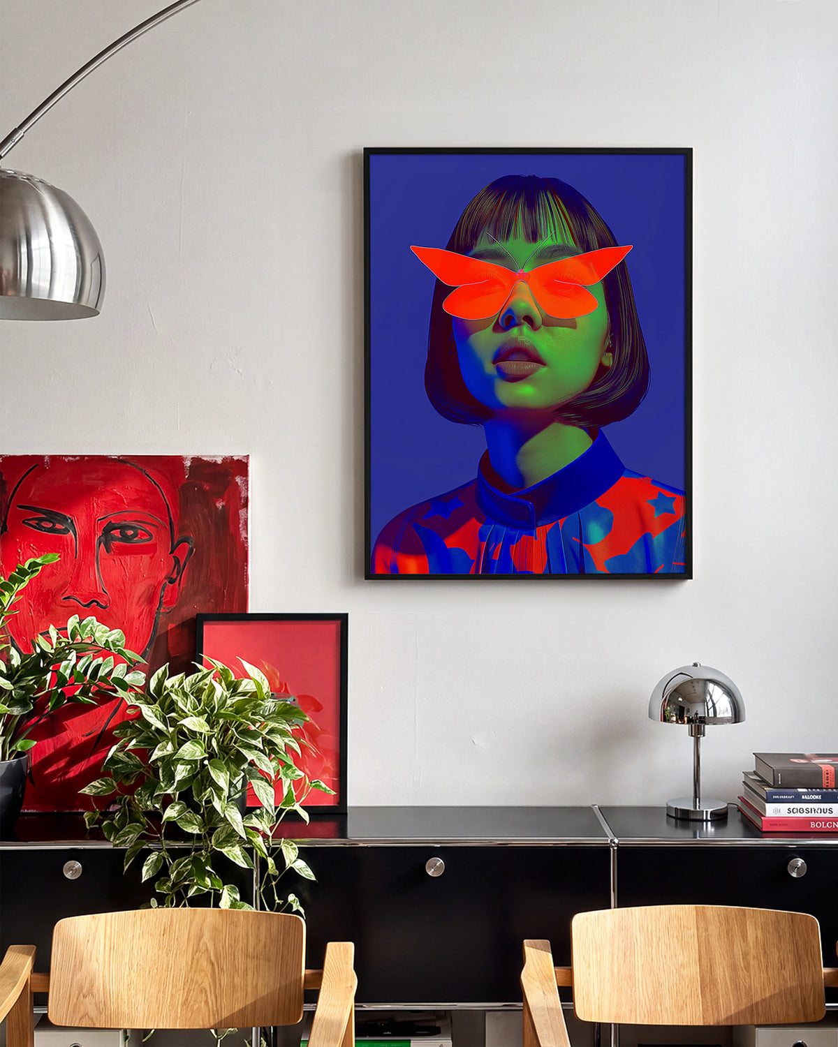 Butterfly Shades pop art portrait print in a black frame on a room wall