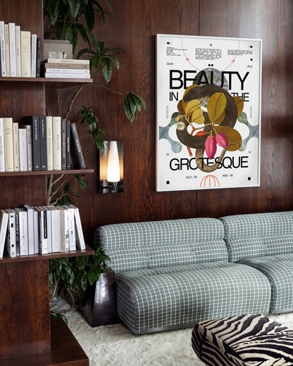 Beauty in the Grotesque quote art print in a white frame on a room wall