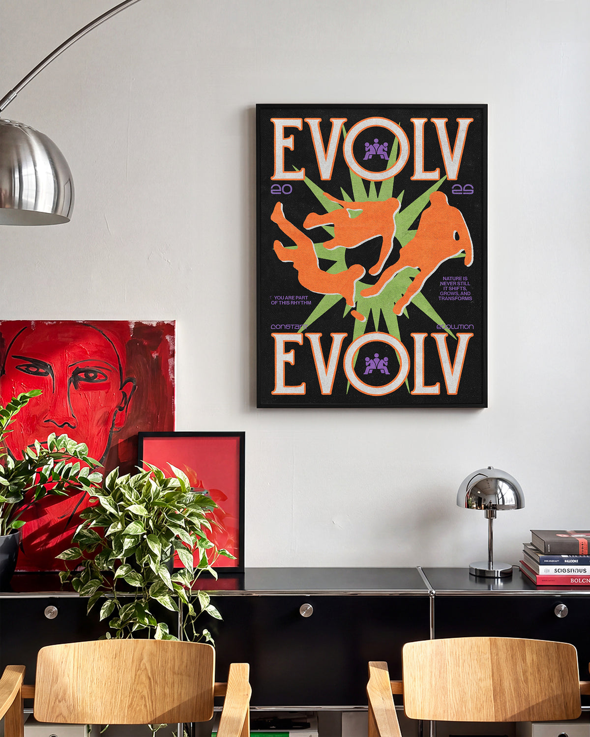 Evolve fantasy art print in a black frame on a room wall