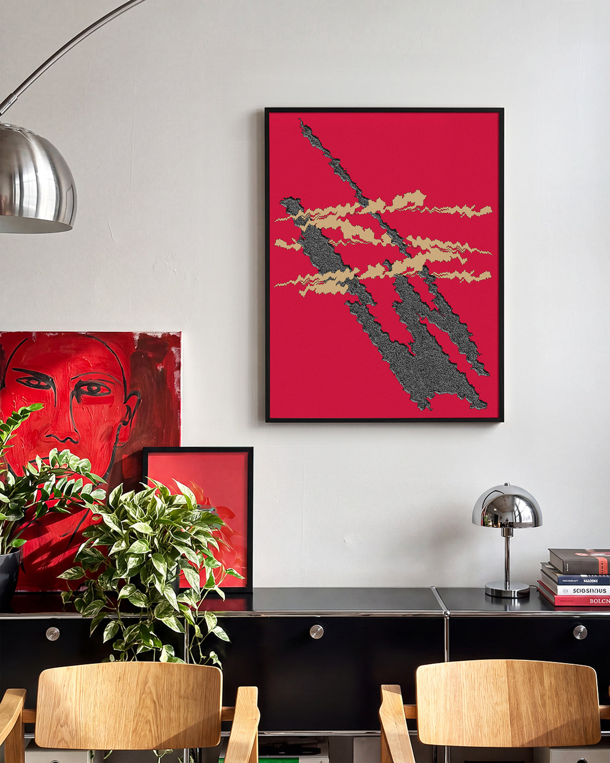 Foundational Red minimalist abstract print in a black frame on a room wall