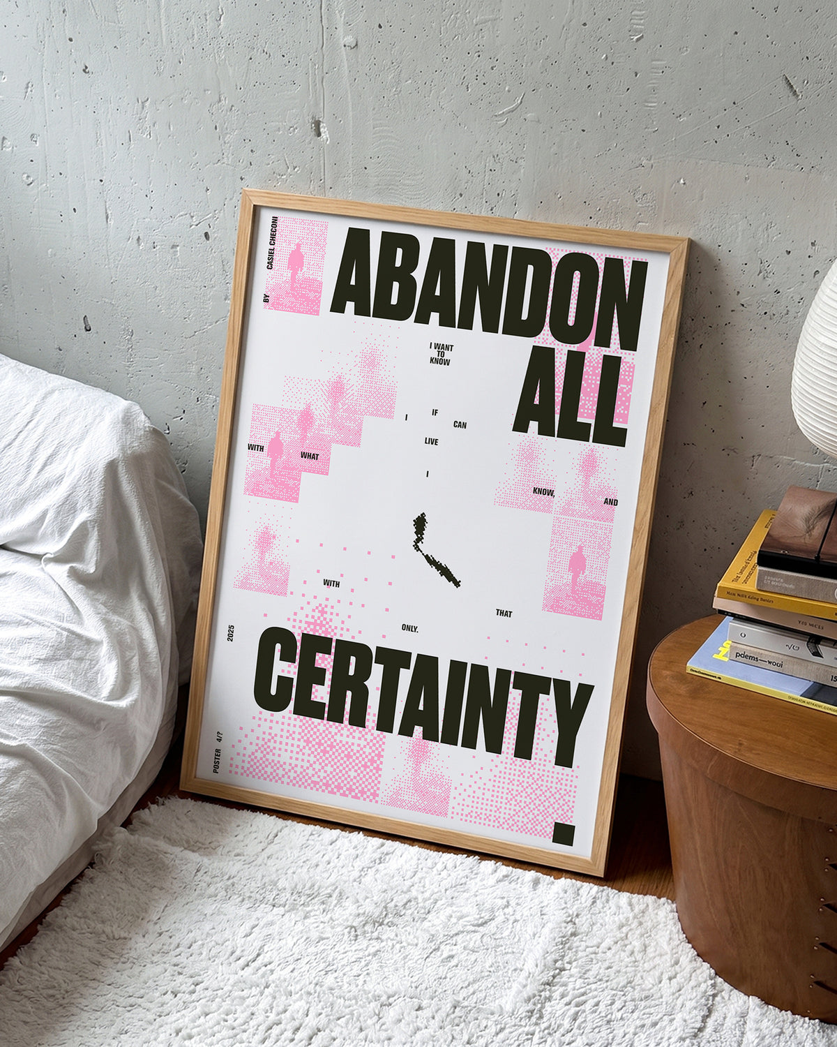 Abandon all certainty minimalist quote print in an oak frame on a wall