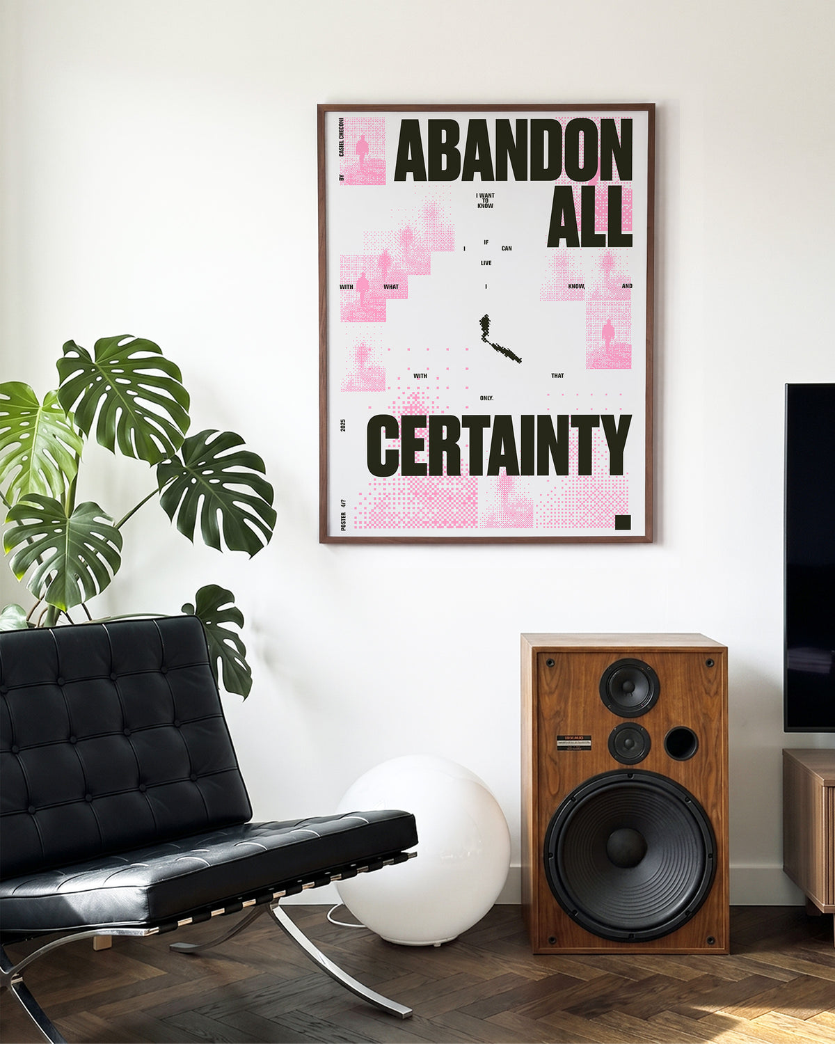 Abandon all certainty minimalist quote print in a walnut frame on a wall