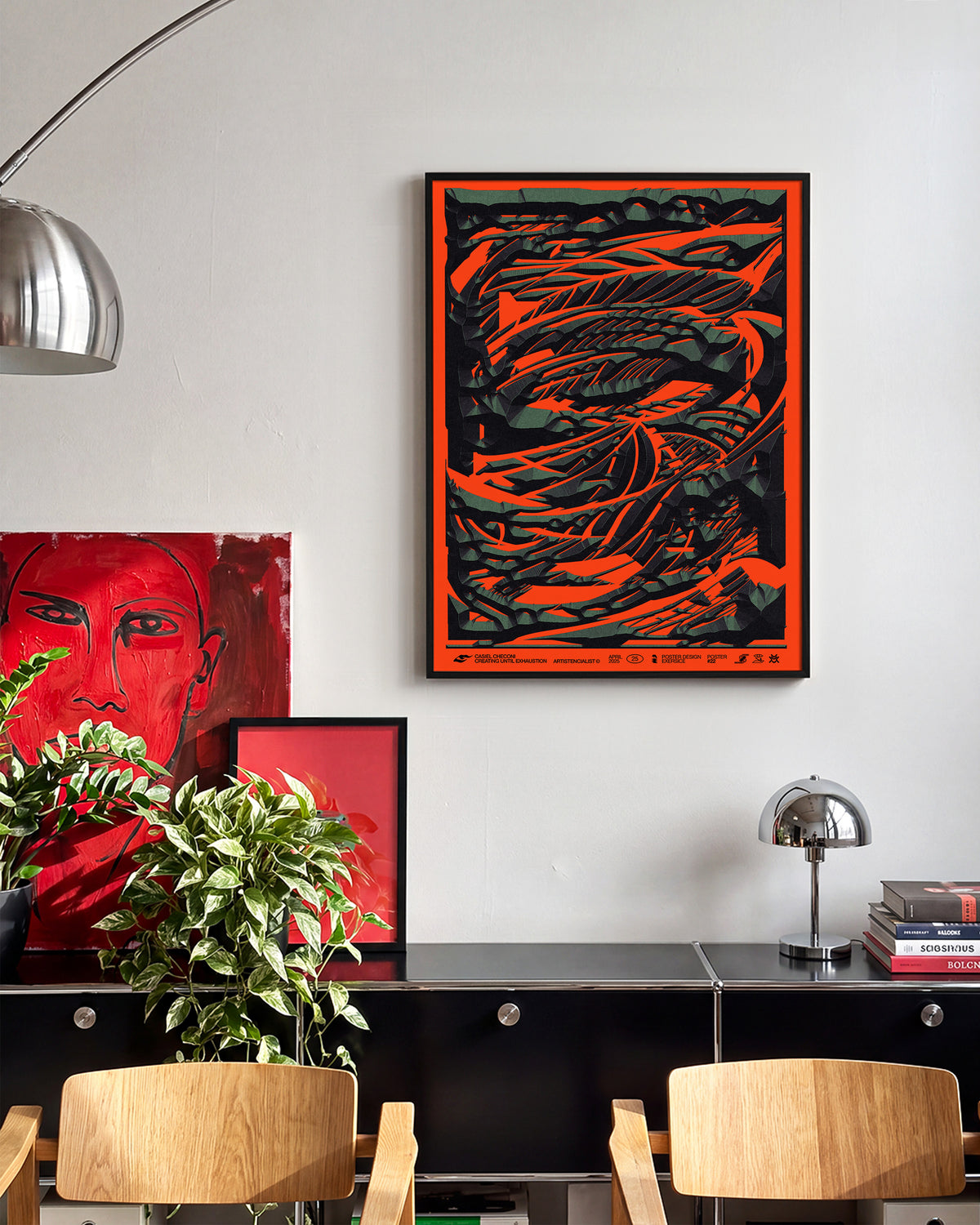 Black stone abstract art print in a black frame on a wall