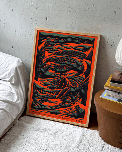 Black stone abstract art print in an oak frame on a wall