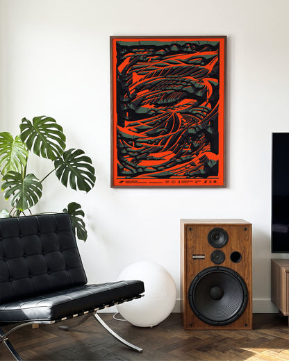 Black stone abstract art print in a walnut frame on a wall