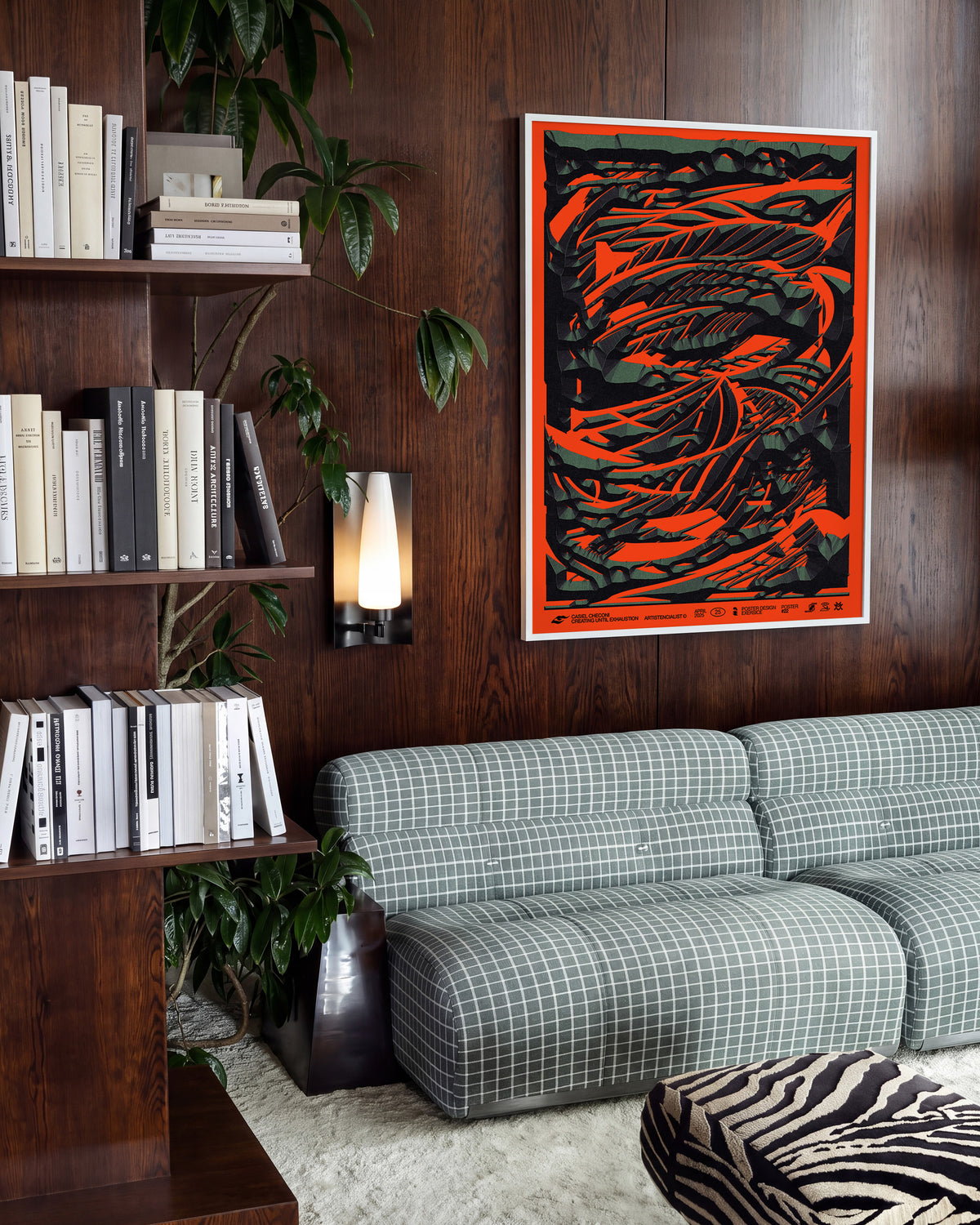 Black stone abstract art print in a white frame on a wall