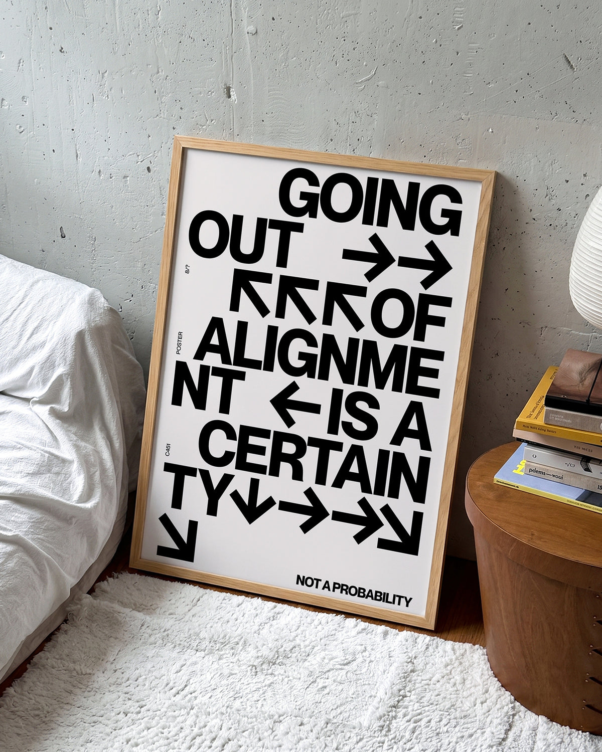 Out of Alignment typography quote print in an oak frame on a wall