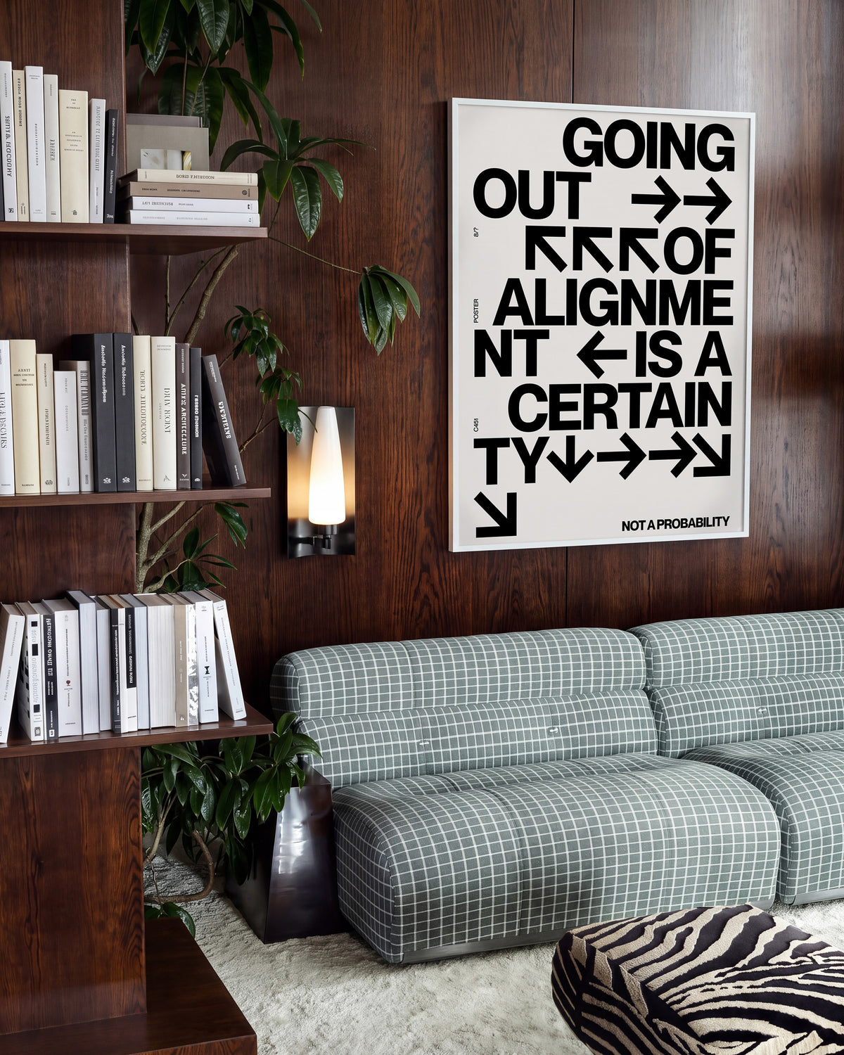 Out of Alignment typography quote print in a white frame on a wall