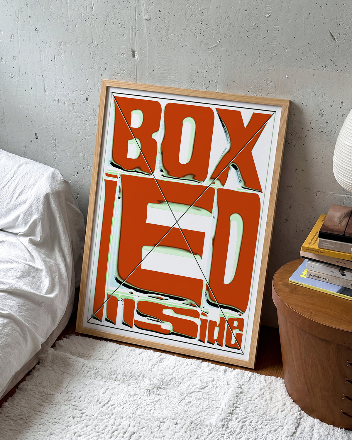 Boxed retro typography quote print in an oak frame on a wall