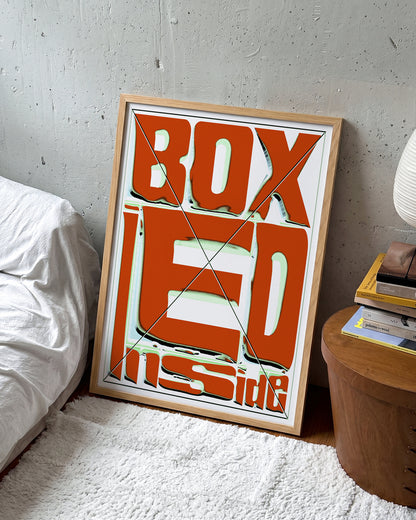 Boxed retro typography quote print in an oak frame on a wall