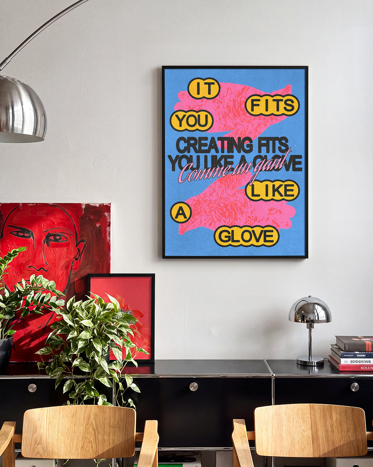 Comme un gant bleu French pop art print in a black frame on a wall