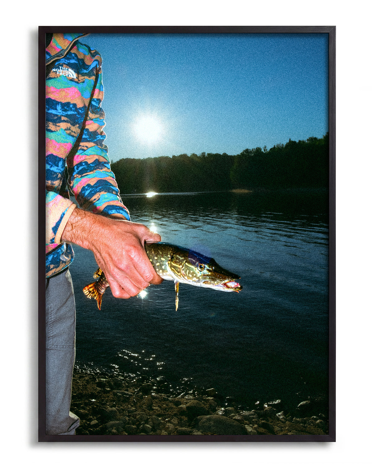 First Catch fishing photography print in a black frame