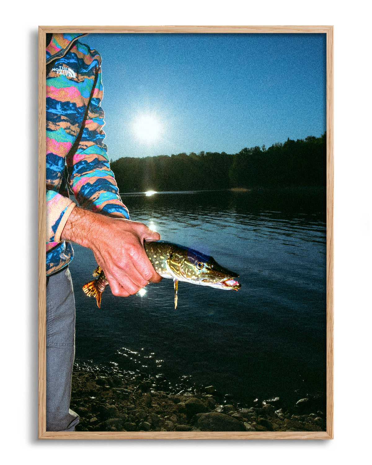 First Catch fishing photography print in an oak frame