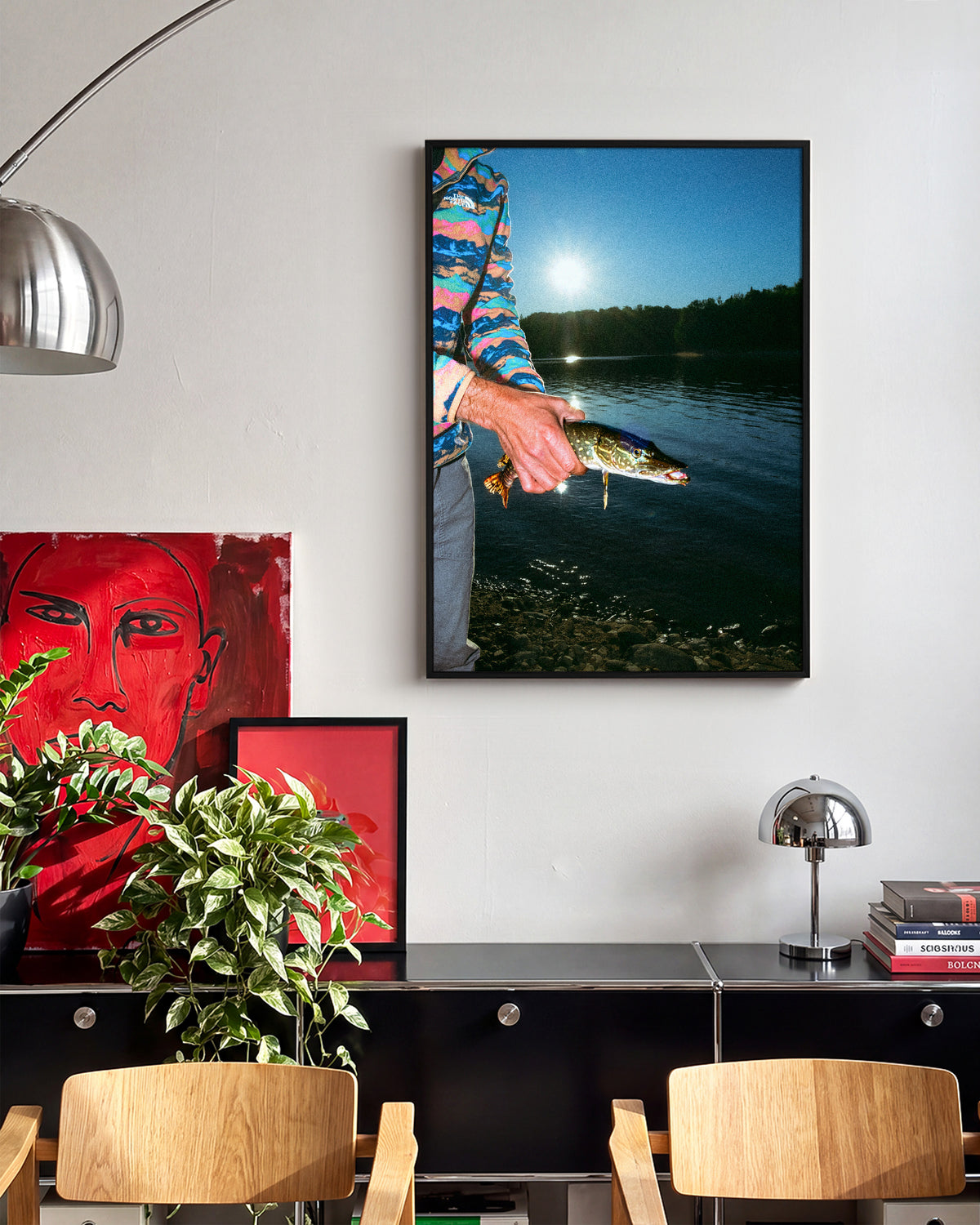 First Catch fishing photography print in a black frame on a wall