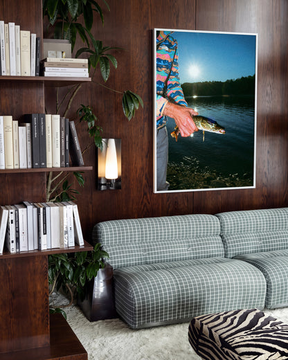 First Catch fishing photography print in a white frame on a wall