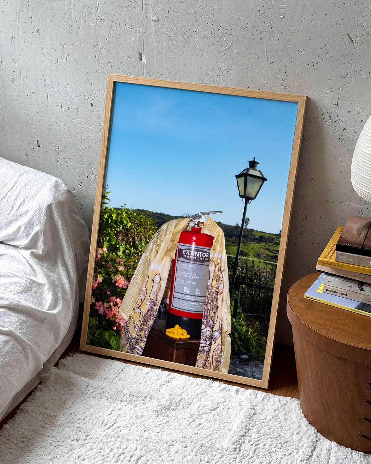 Fire photography art print in an oak frame on a wall