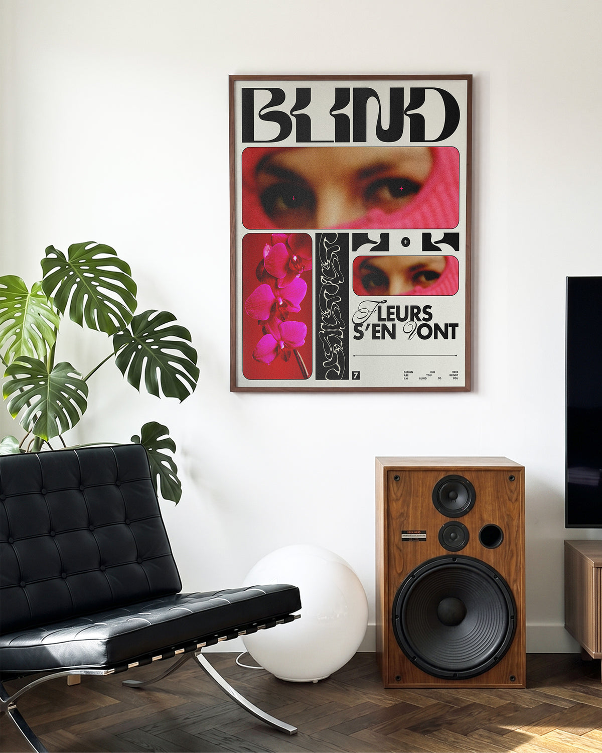 Blind typography graphic print in a walnut frame on a wall