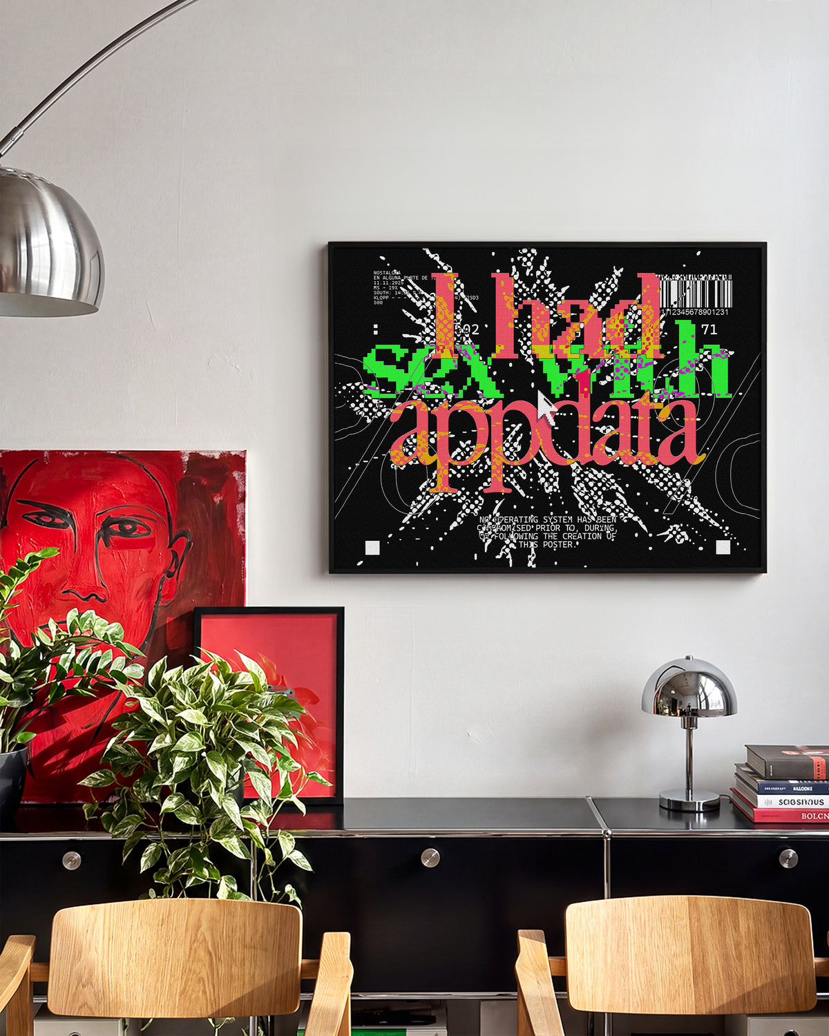 Appdata maximalist typography print in a black frame on a wall