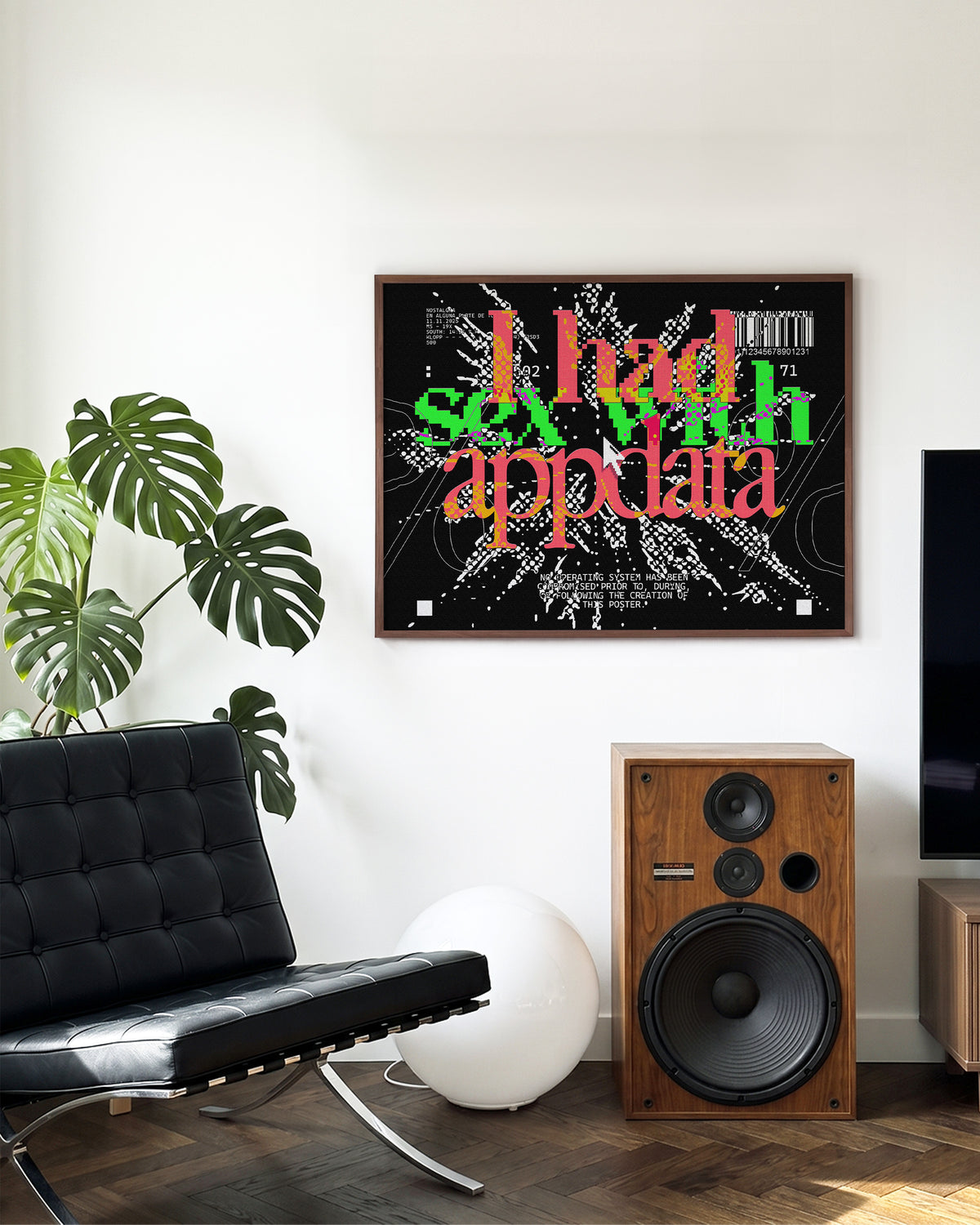 Appdata maximalist typography print in a walnut frame on a wall