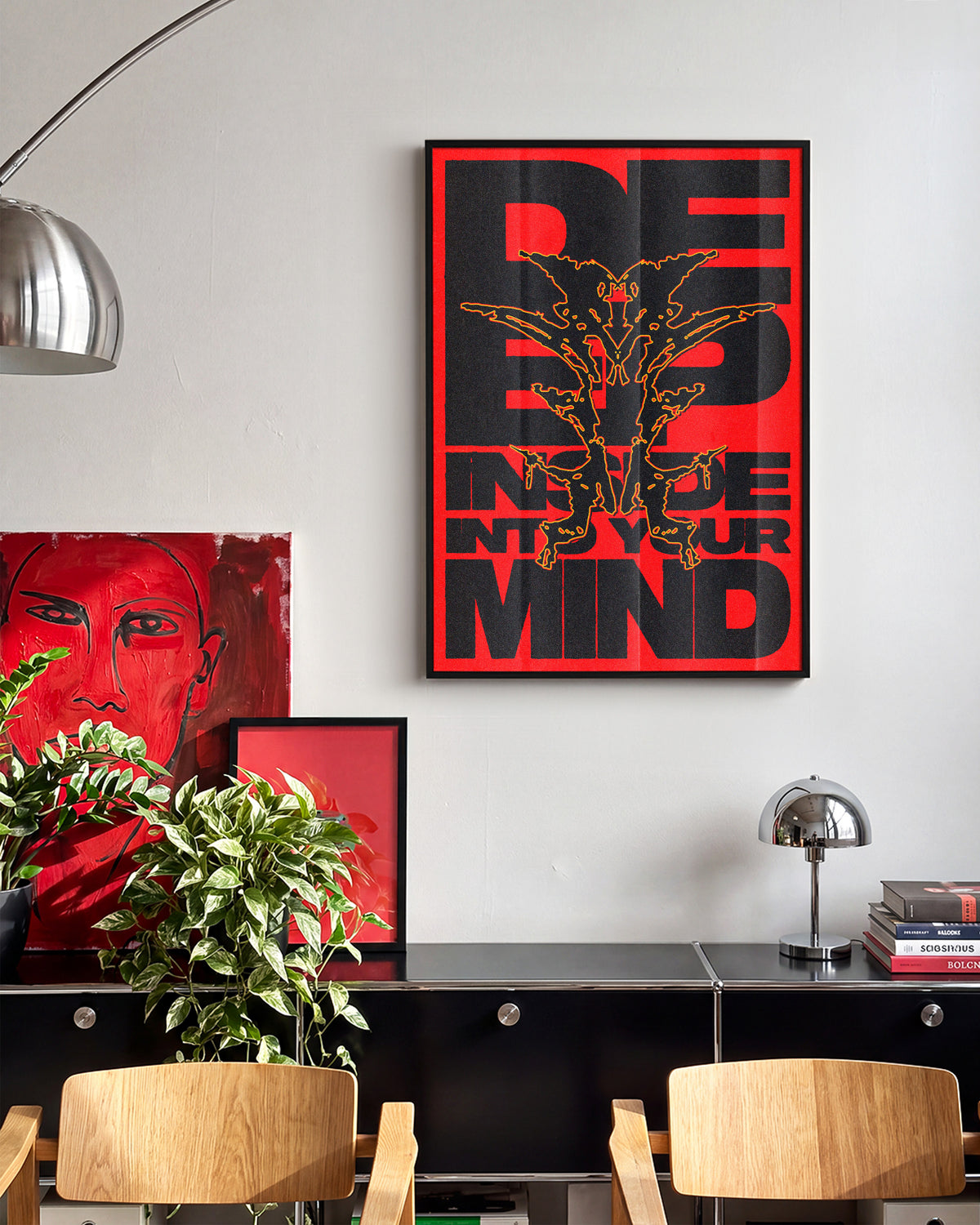 Deep typography quote poster in a black frame on a wall