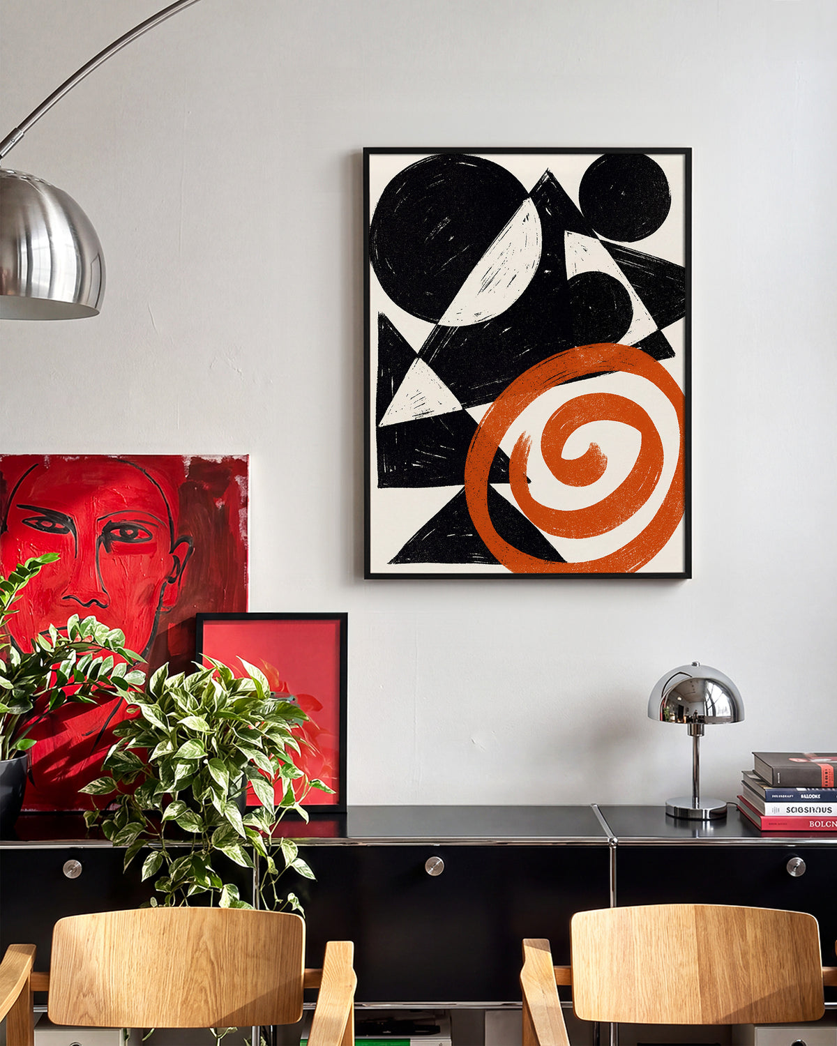 Ember Spiral abstract spiral art print in a black frame on a wall