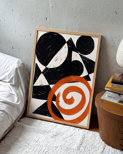 Ember Spiral abstract spiral art print in an oak frame on a wall