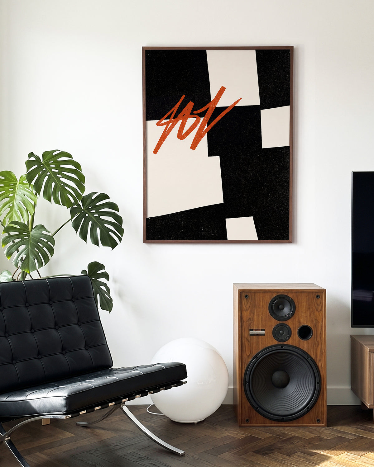 Blockout geometric abstract poster in a walnut frame on a wall