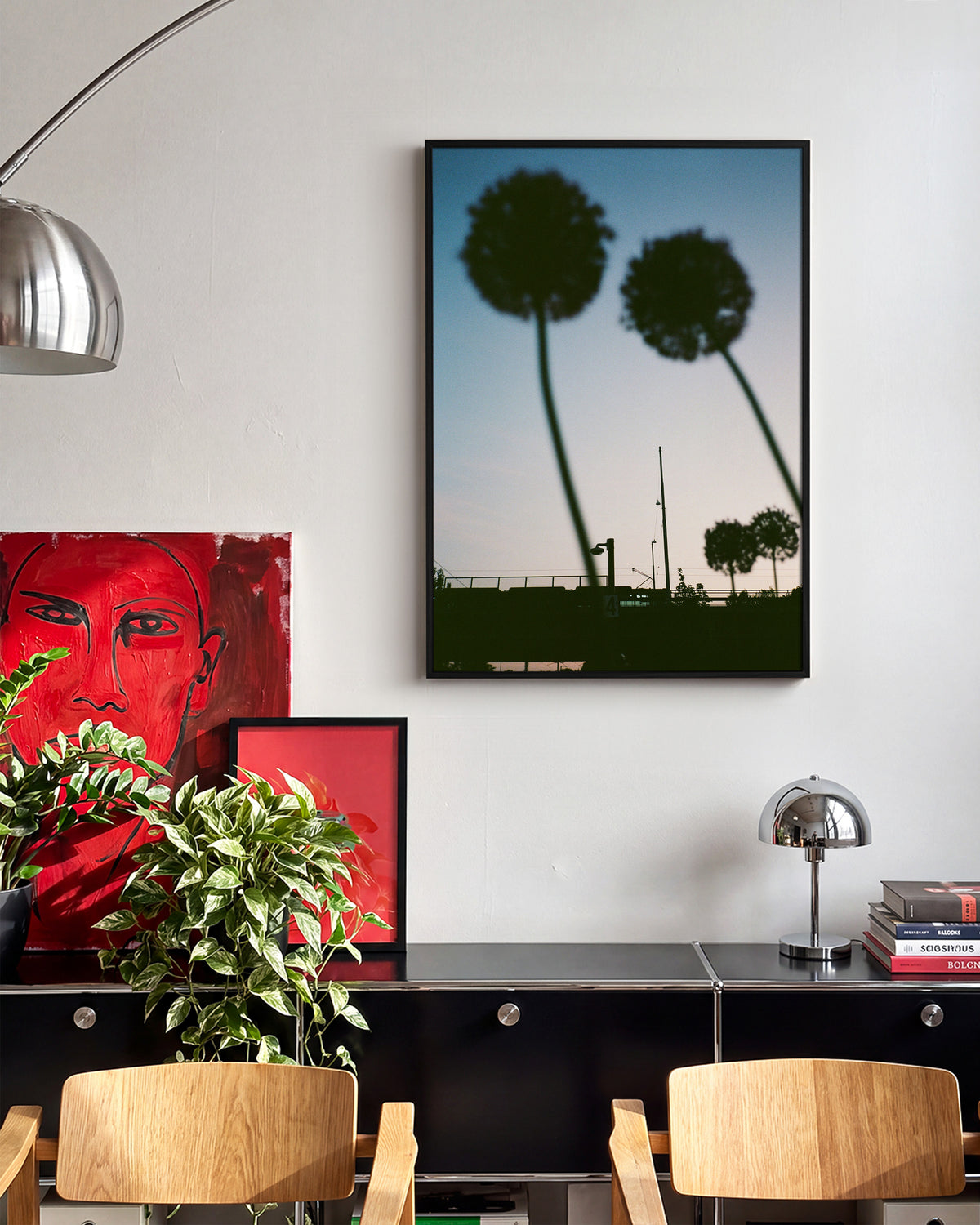 Blue hour minimalist landscape photography print in a black frame on a wall