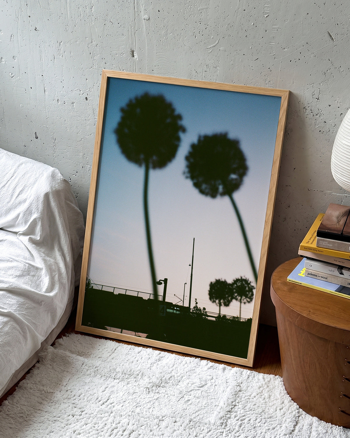 Blue hour minimalist landscape photography print in an oak frame on a wall
