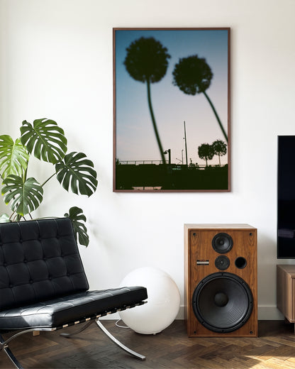 Blue hour minimalist landscape photography print in a walnut frame on a wall
