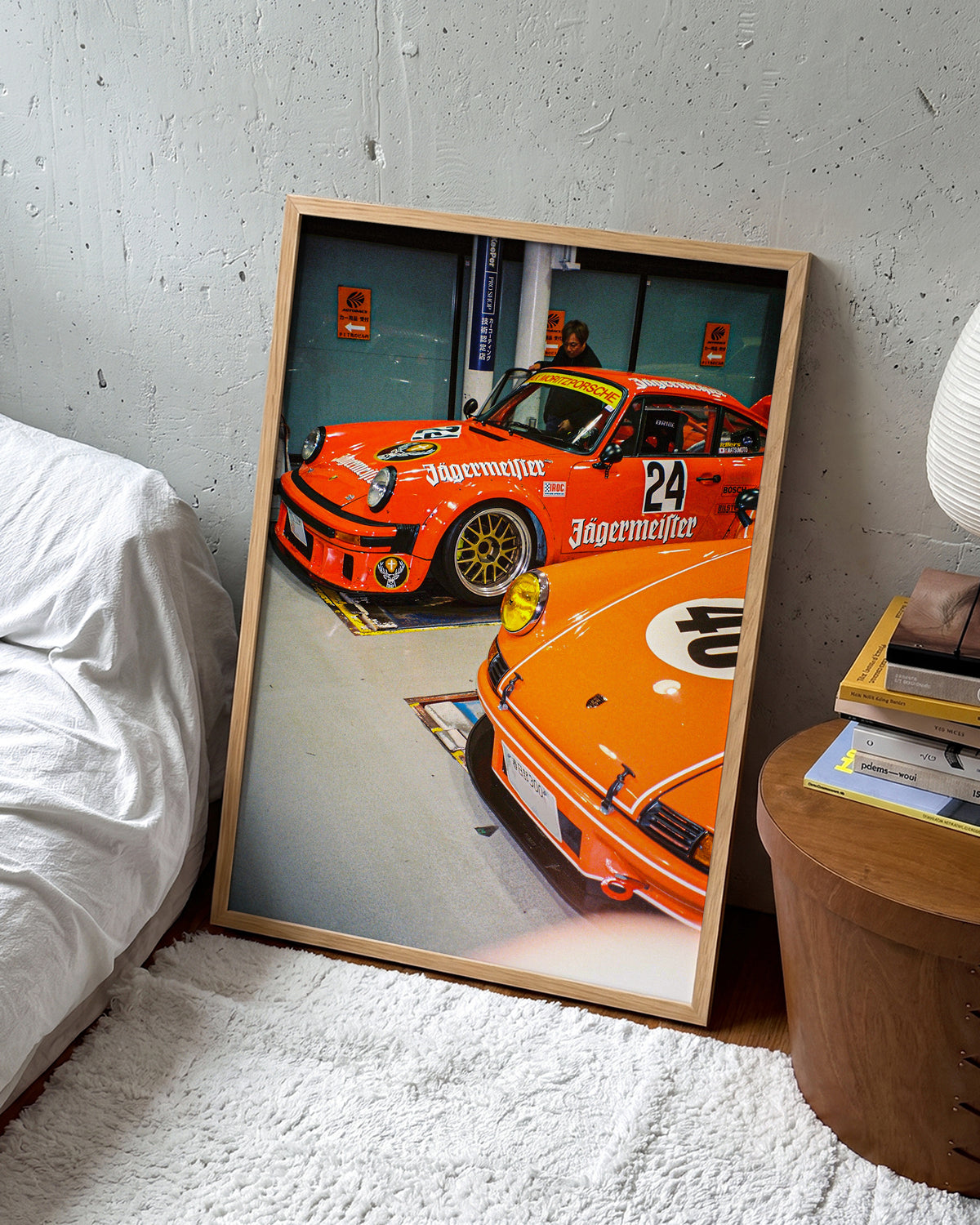 Anija retro motorsport photography print in an oak frame on a wall