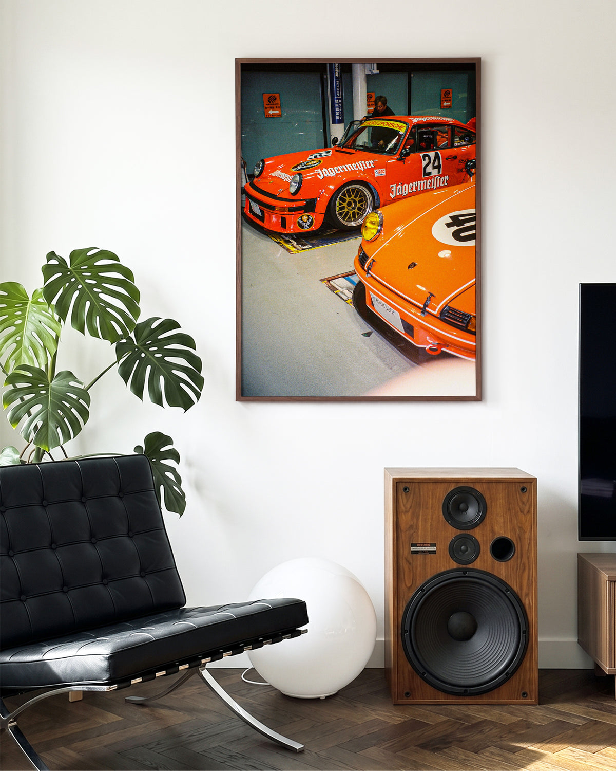 Anija retro motorsport photography print in a walnut frame on a wall