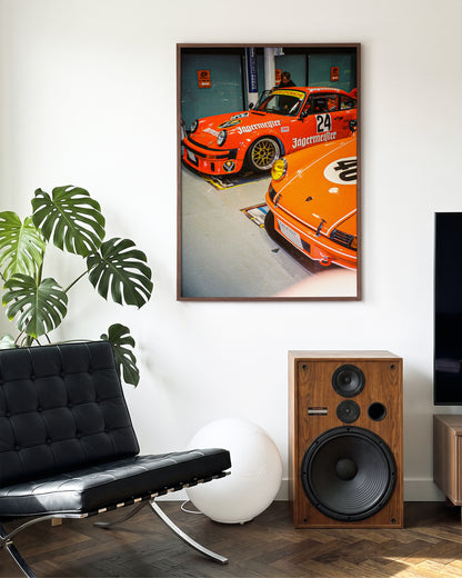 Anija retro motorsport photography print in a walnut frame on a wall