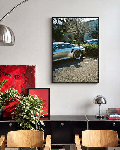 Andreezy 17 minimalist car photography print in a black frame on a wall