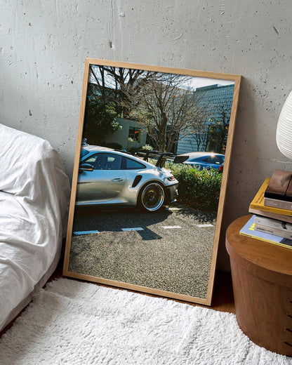 Andreezy 17 minimalist car photography print in an oak frame on a wall