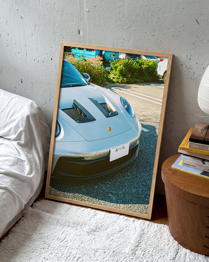 Andreezy 19 minimalist JDM car photography print in an oak frame on a wall