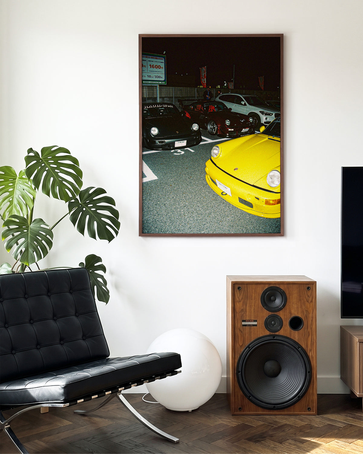 Andreezy 21 bold JDM car photography print in a walnut frame on a wall