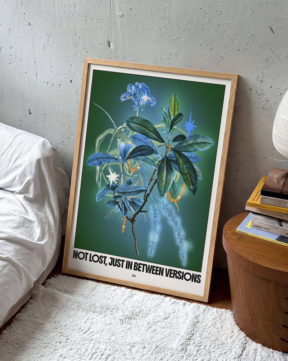 Between versions retro quote collage print in an oak frame on a wall