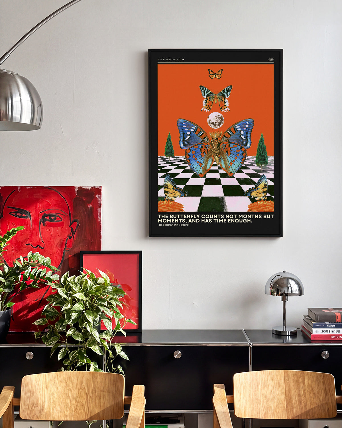 Butterfly psychedelic pop art collage print in a black frame on a wall