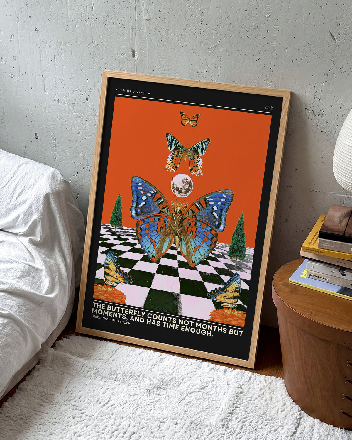 Butterfly psychedelic pop art collage print in an oak frame on a wall
