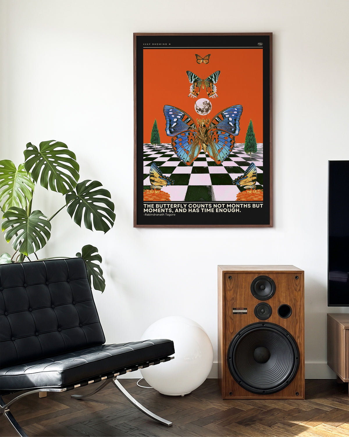 Butterfly psychedelic pop art collage print in a walnut frame on a wall
