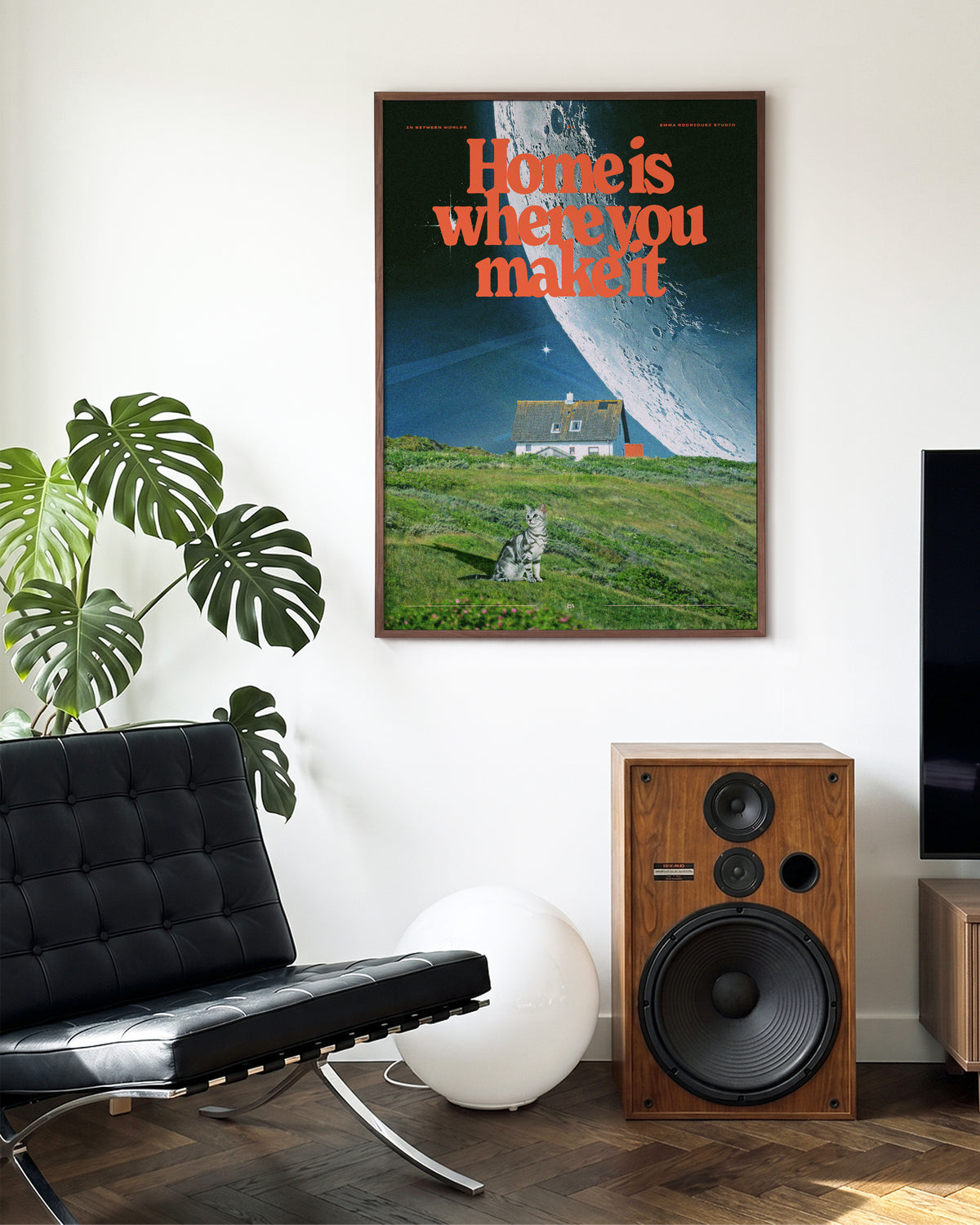 Between worlds retro space collage print in a walnut frame on a wall