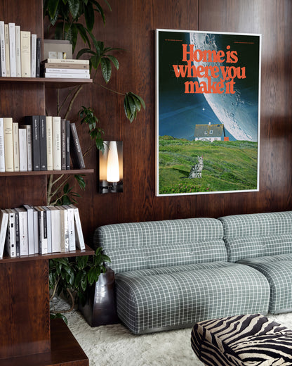Between worlds retro space collage print in a white frame on a wall