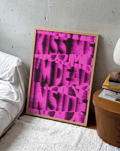 Kiss Me I'm Dead Inside funny quote poster in an oak frame on a wall