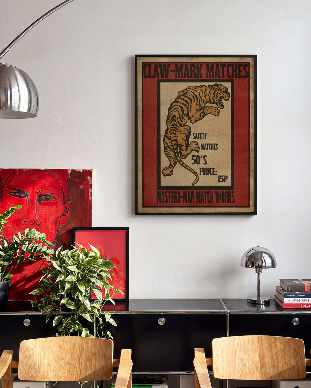 Claw Mark Matches vintage matchbox art print in a black frame on a wall