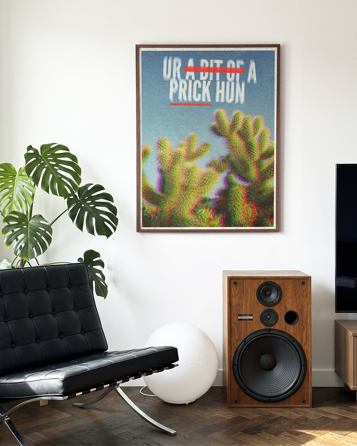 Bit of a Prick funny cactus quote poster in a walnut frame on a wall